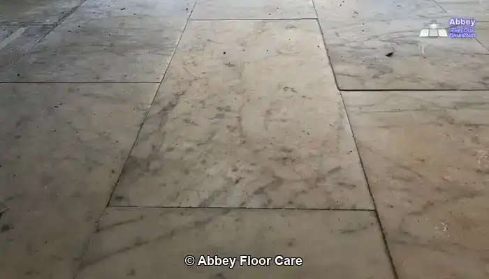 marble with iron oxide staining before restoration