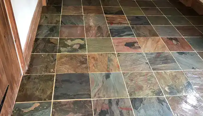 Restored slate floor with clearer colour variation and balanced surface tone